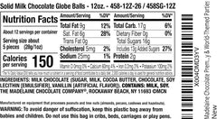 The Madelaine World Globe Balls close-up reveals a creamy milk chocolate texture.