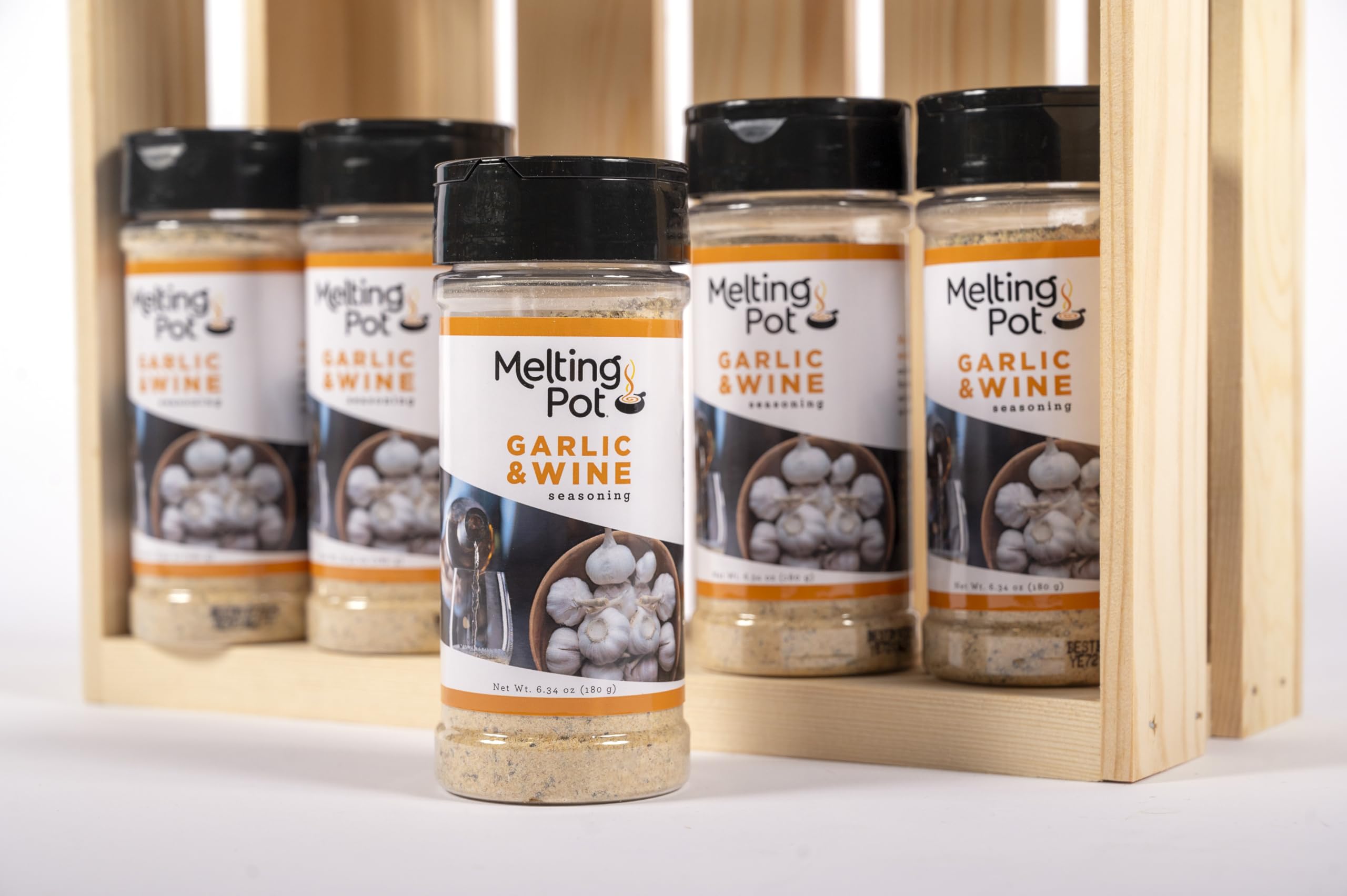 Close-up of The Melting Pot seasoning jar reveals real garlic and herbs.
