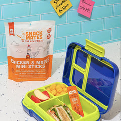 The New Primal Snack Mates Kids Chicken Maple Stick pack on a lunchbox, easy to grab.