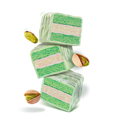 CakeBites Pistachio cross-section with icing and vanilla cream, showcasing layered flavors