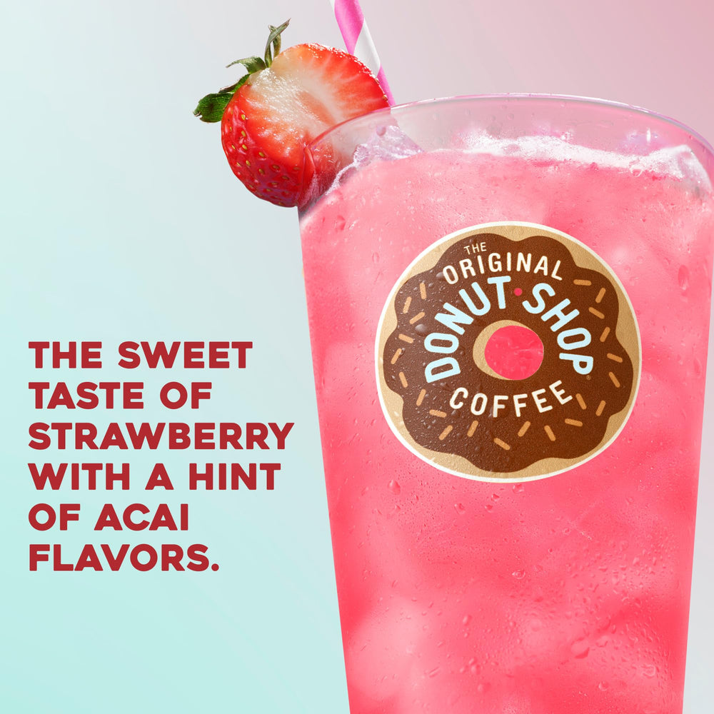A tumbler with ice showcases a bright pink iced beverage.