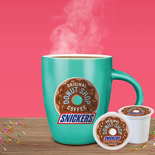 Cozy kitchen scene with The Original Donut Shop Snickers branding