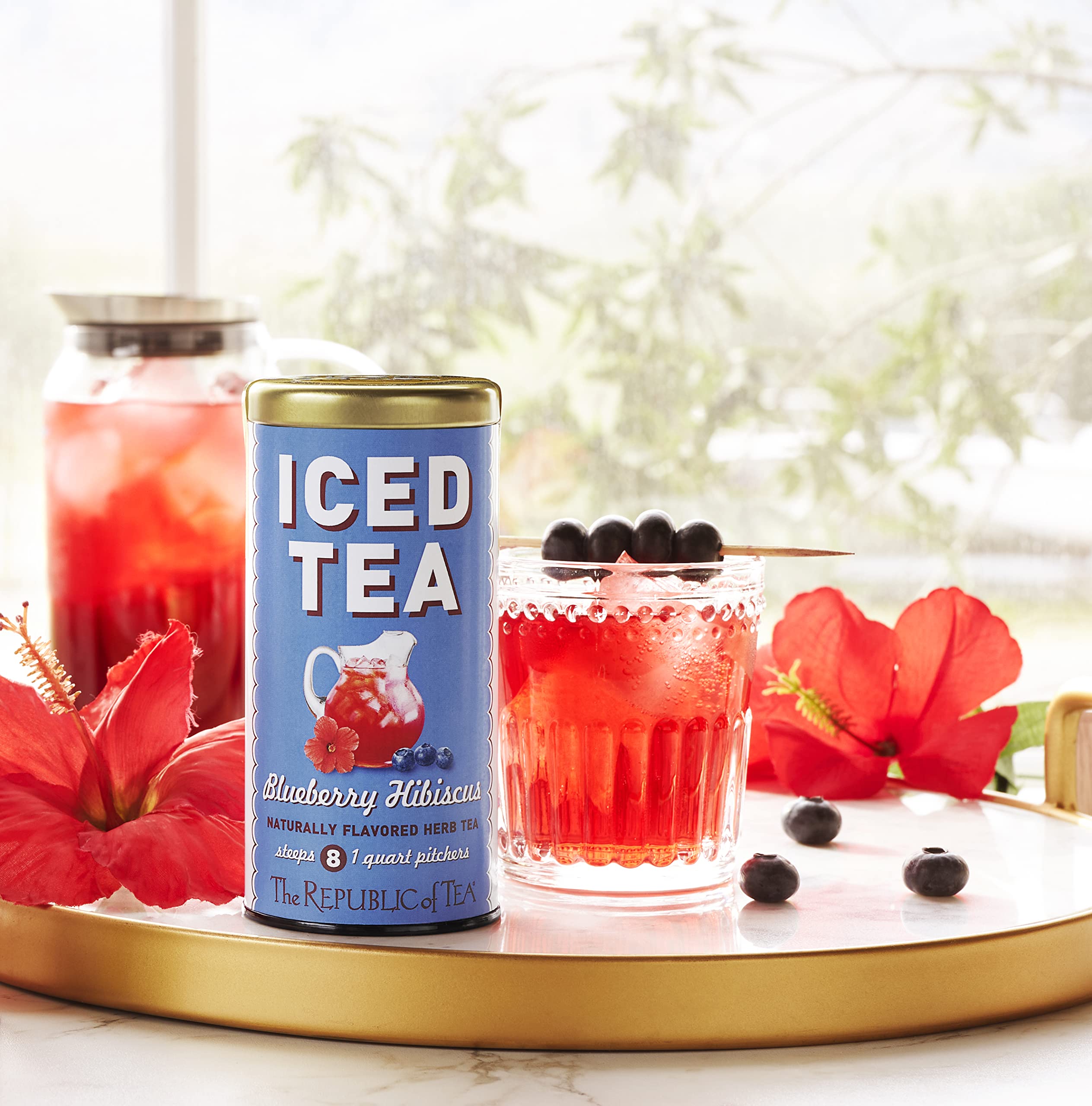 The Republic of Tea Blueberry Hibiscus Iced Tea pitcher pour, ideal for gatherings.