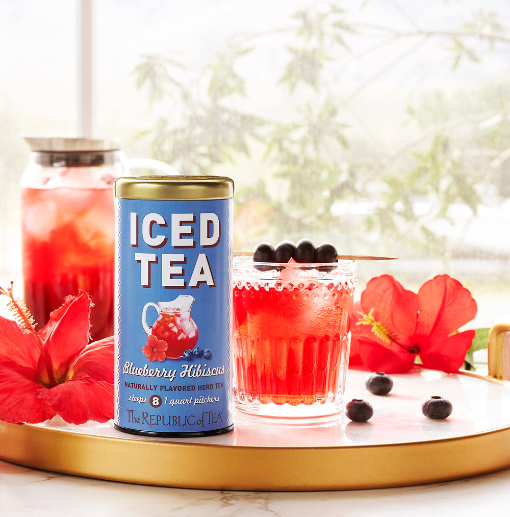 The Republic of Tea Blueberry Hibiscus Iced Tea pitcher pour, ideal for gatherings.