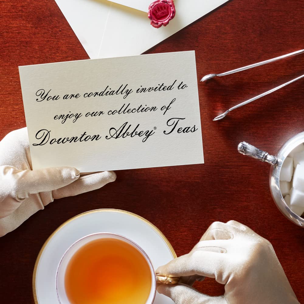 Brewing Downton Abbey English Rose tea into a pale pink cup.