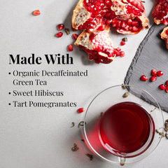 The Republic of Tea pomegranate green tea decaf packaging highlighting organic ingredients.