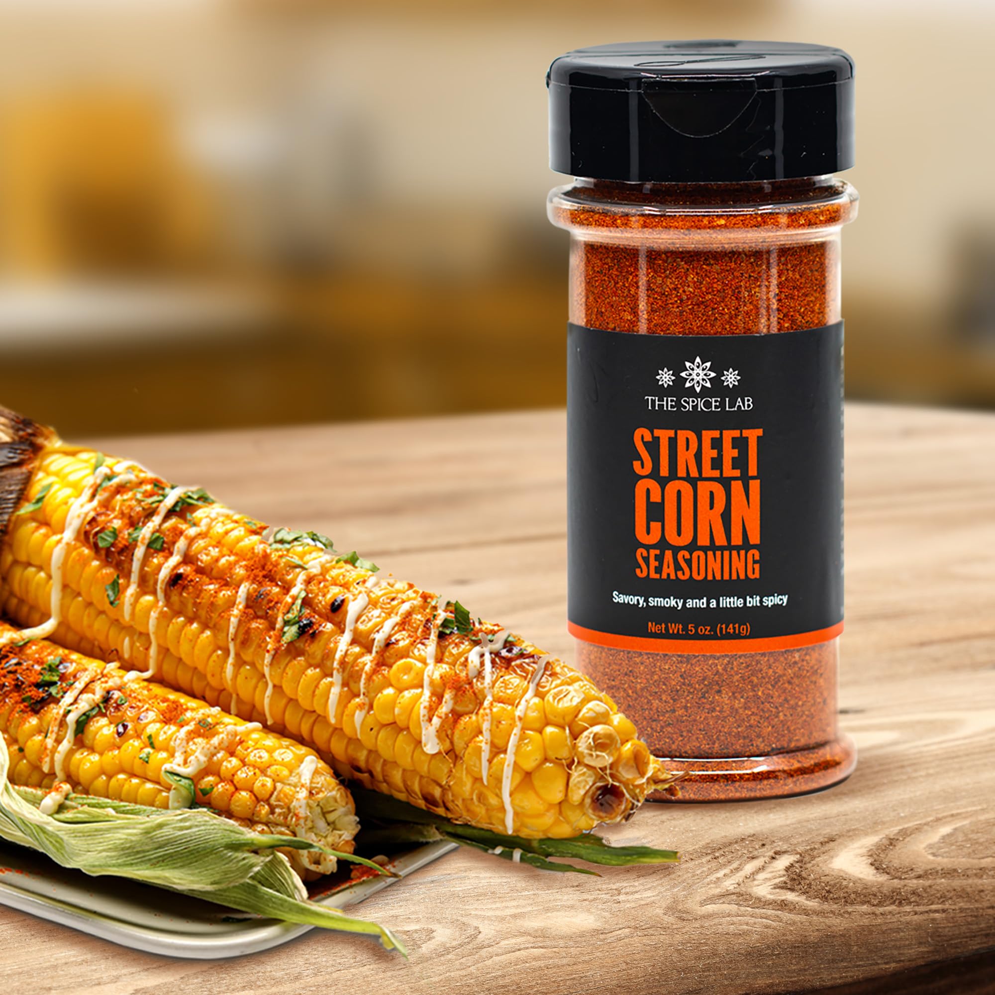 Grilled corn sprinkled with The Spice Lab elote seasoning for bold flavor