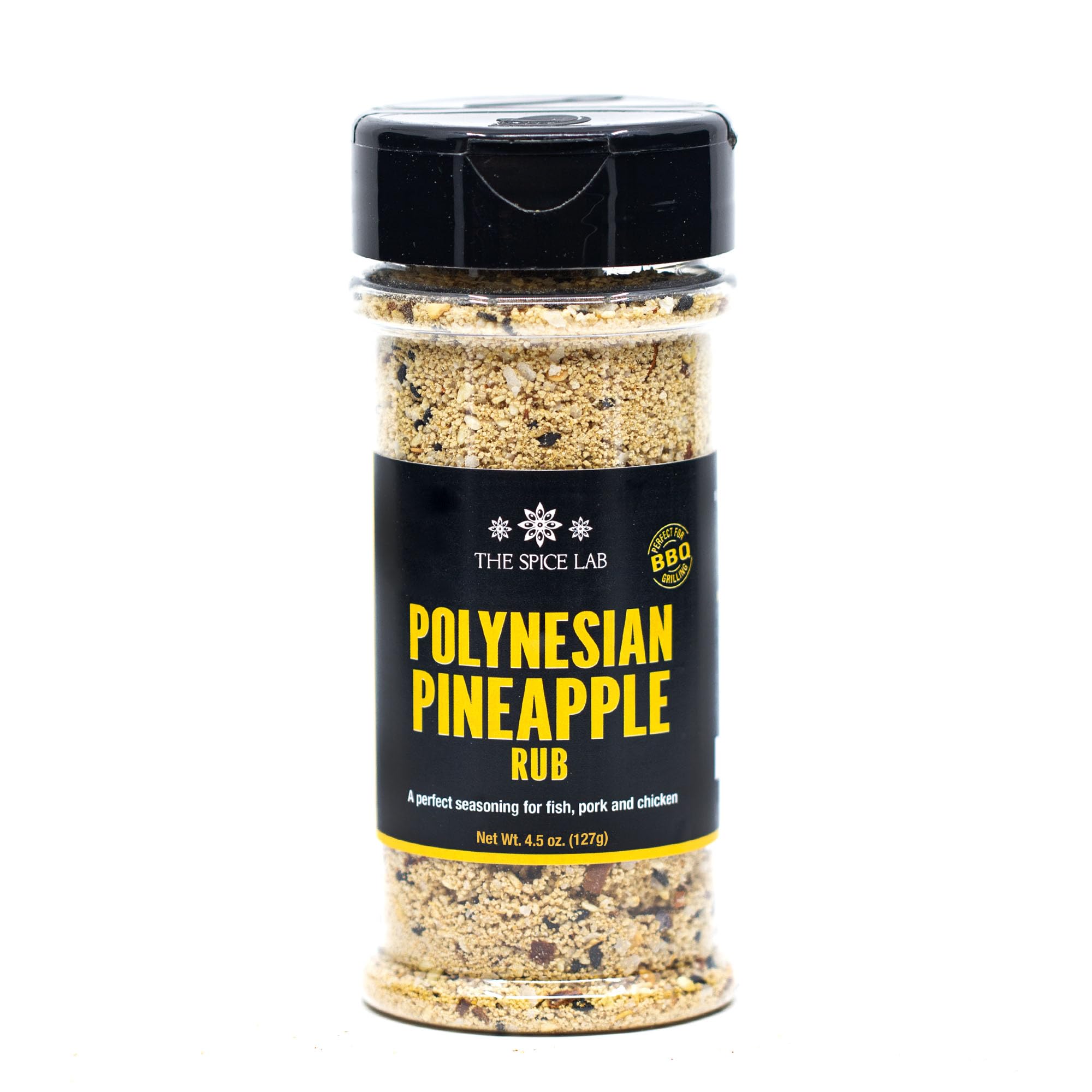 The Spice Lab Polynesian Pineapple Rub bottle boosts seafood with tropical sweetness.