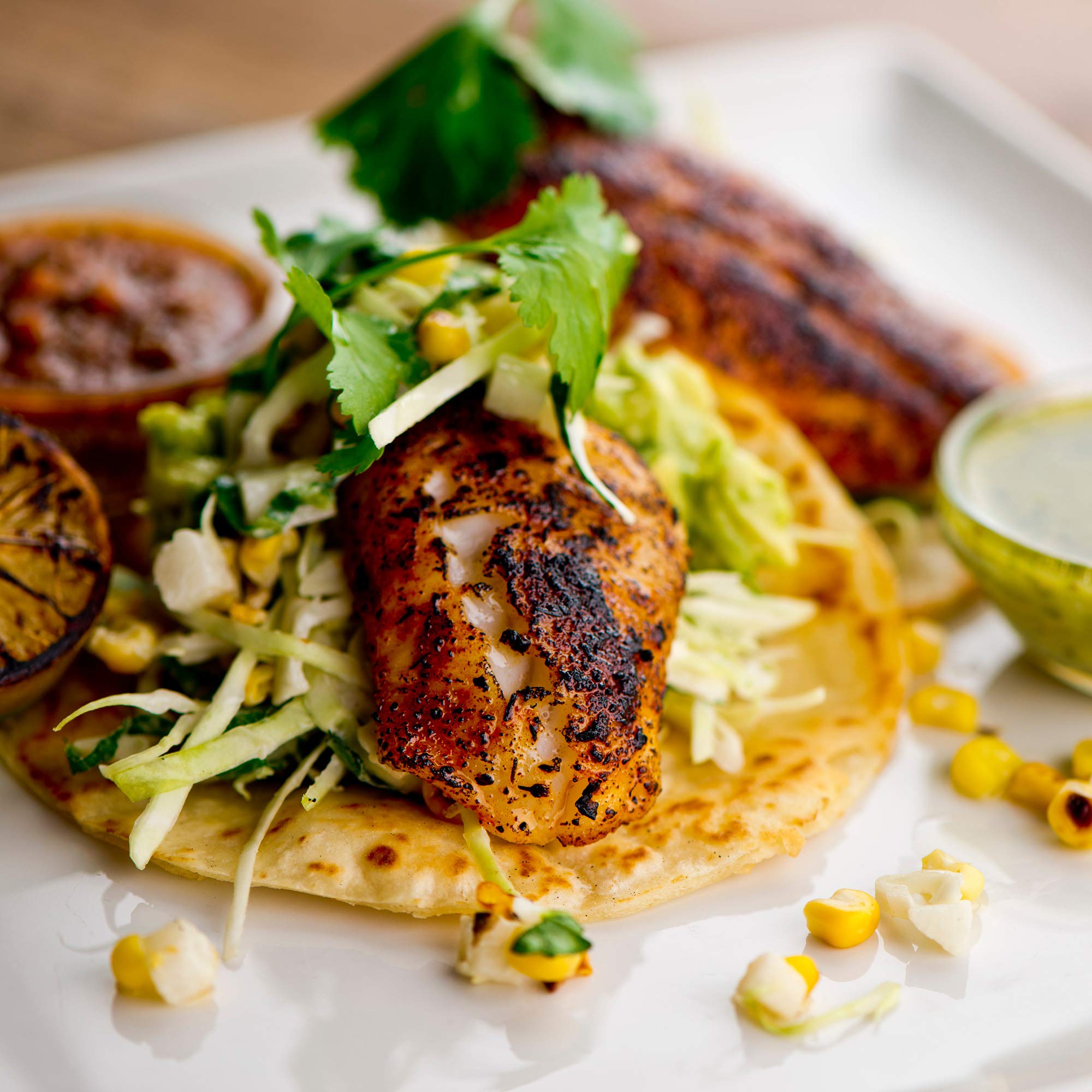 Dinner plates featuring tacos seasoned with The Spice Lab blend