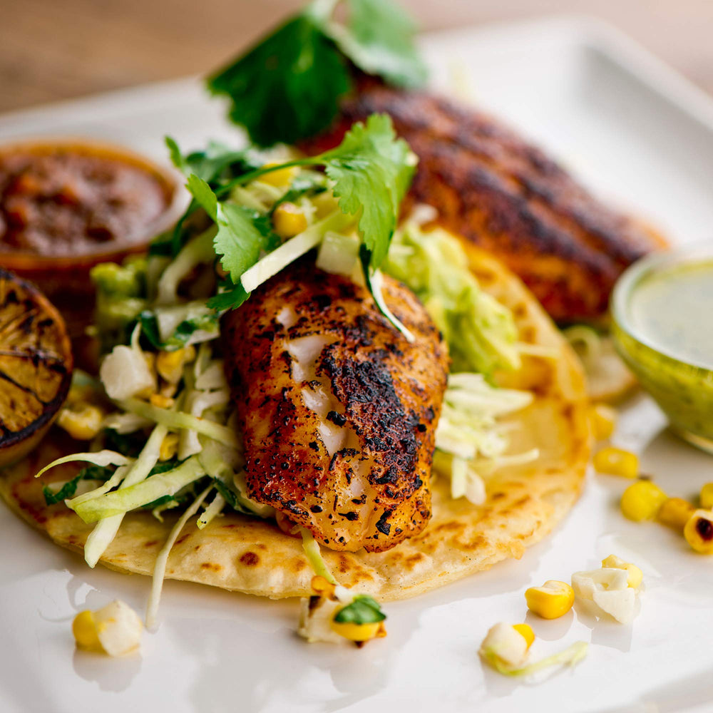 Dinner plates featuring tacos seasoned with The Spice Lab blend