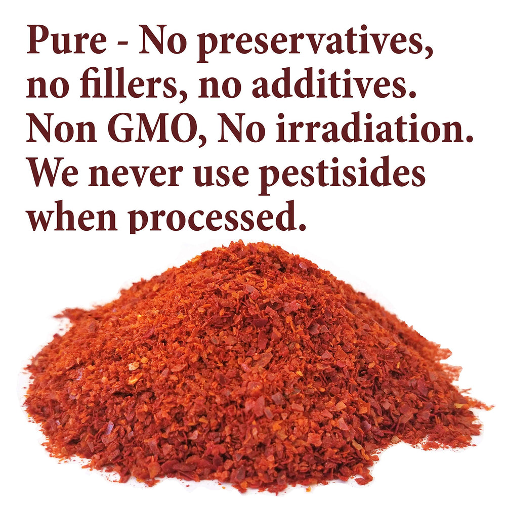 Aleppo pepper ground on spoon from The Spice Way highlighting fine texture
