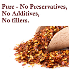 The Spice Way Crushed Red Pepper Flakes on shelf display shows premium seasoning.
