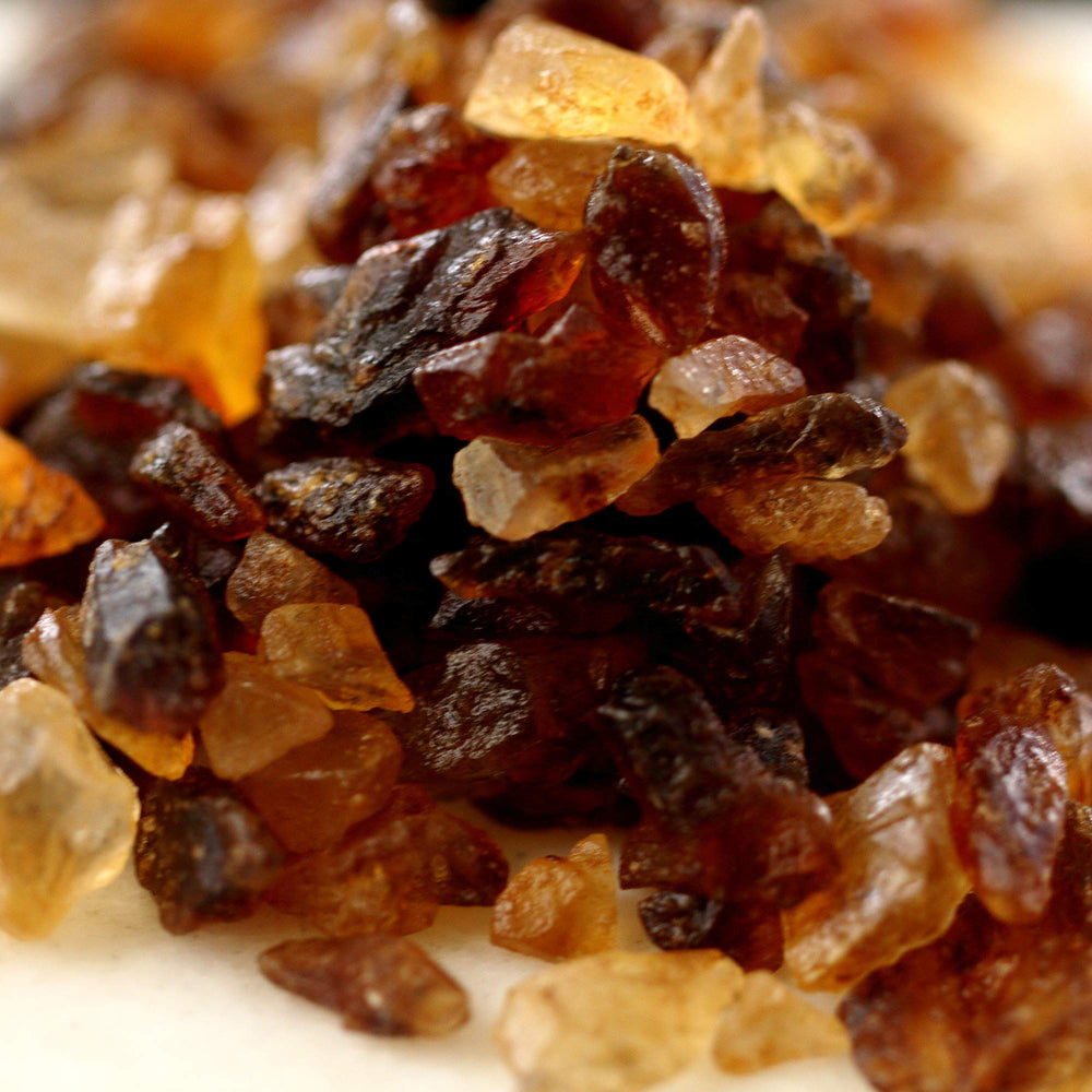 The Sugar Lab amber-brown crystals on a surface capture molasses tones beautifully