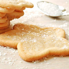 The Sugar Lab confectioners sugar extra coarse glass bottle shows gourmet crystals for baking.