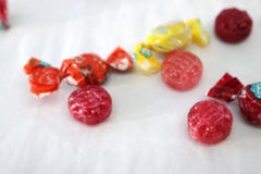 TheCandyCo Organic Hard Candy Assortment flavor labels show Meyer Lemon & Raspberry.
