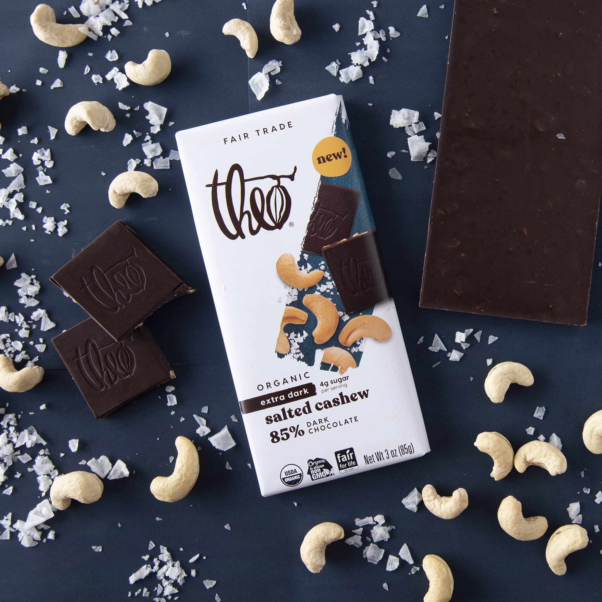 Unwrapped THEO 85% dark chocolate bar highlighting premium ingredients.