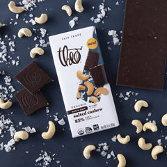 Unwrapped THEO 85% dark chocolate bar highlighting premium ingredients.