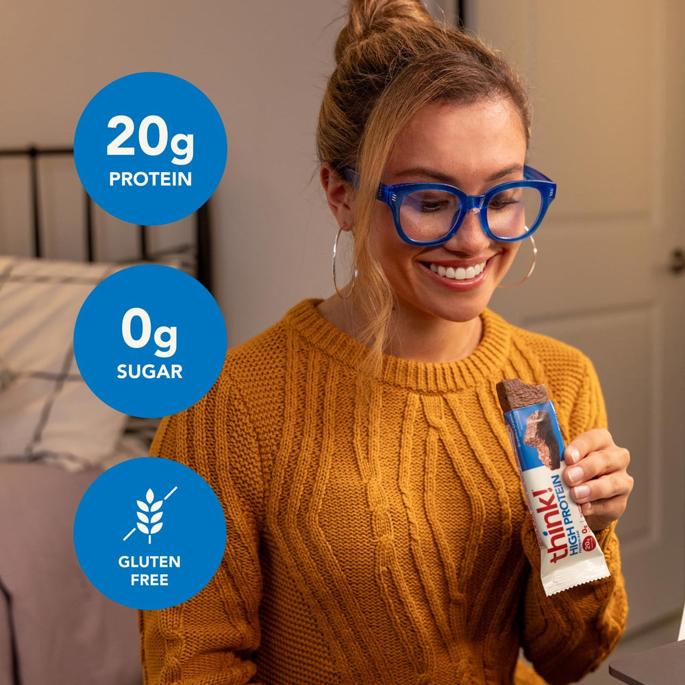 Think Brownie Crunch bar ingredients displayed with almonds and chocolate for clean nutrition