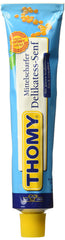 Thomy Delikatess mustard tube close-up label showing classic, versatile flavor for sandwiches.