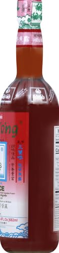 Three Crabs Fish Sauce bottle in a home kitchen setting for easy seasoning.