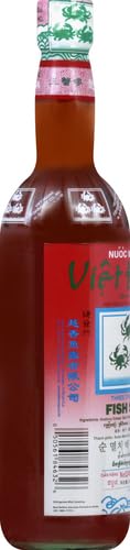 Three Crabs Fish Sauce tilted bottle ready for kitchen prep.