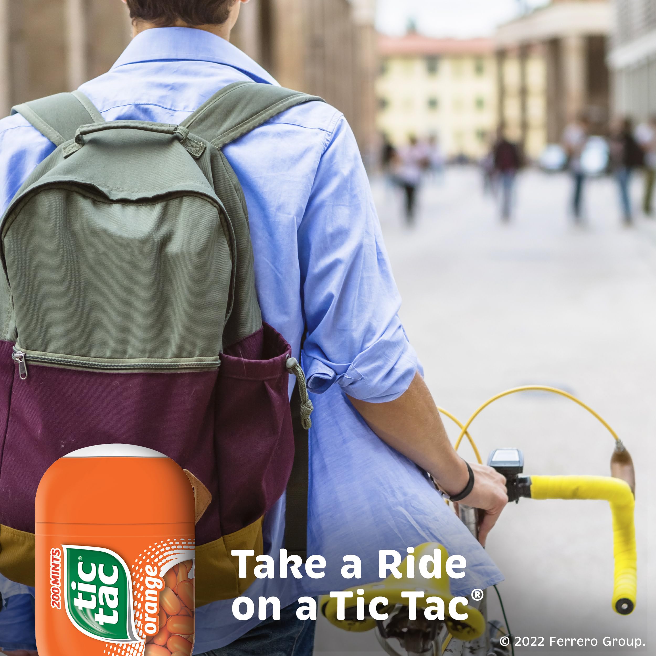 Tic Tac Orange Mints close-up reveals vibrant orange flavor in each mint.