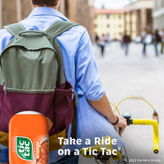 Tic Tac Orange Mints close-up reveals vibrant orange flavor in each mint.