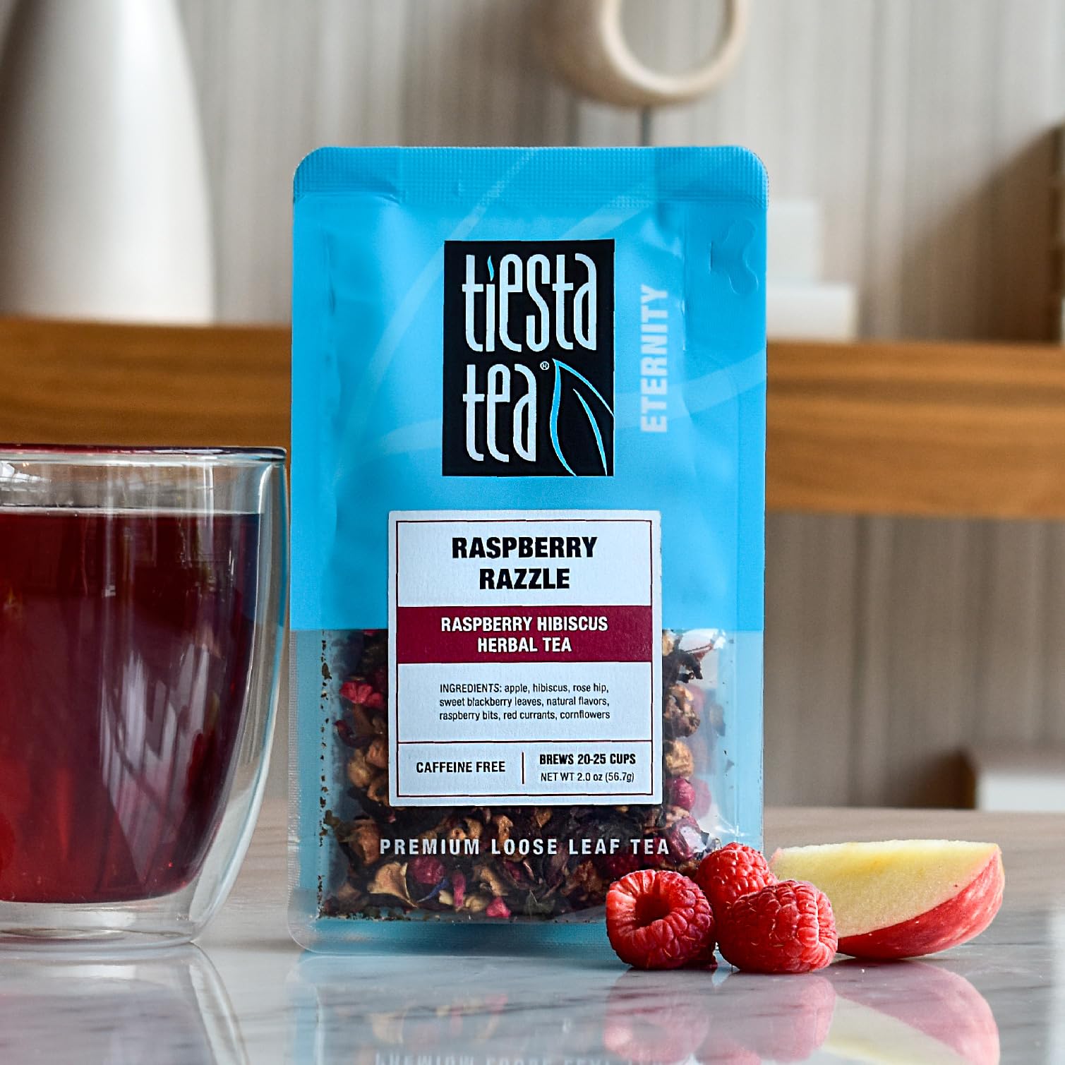 Tiesta Tea Raspberry Razzle brewed cup displaying tart hibiscus and raspberry harmony