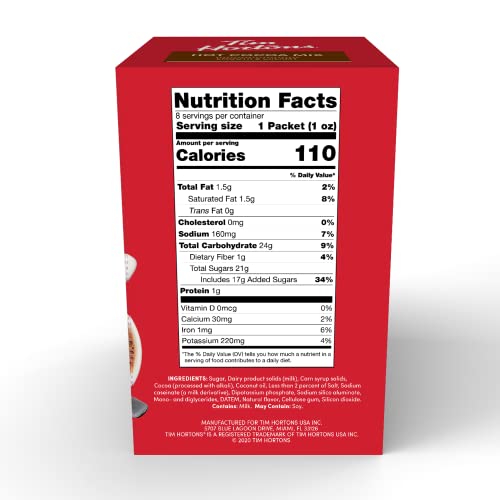 Tim Hortons hot cocoa mix packet dispensing into mug for easy preparation.