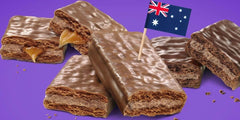 Tim Tam cross-section shows creamy filling between crunchy biscuits.