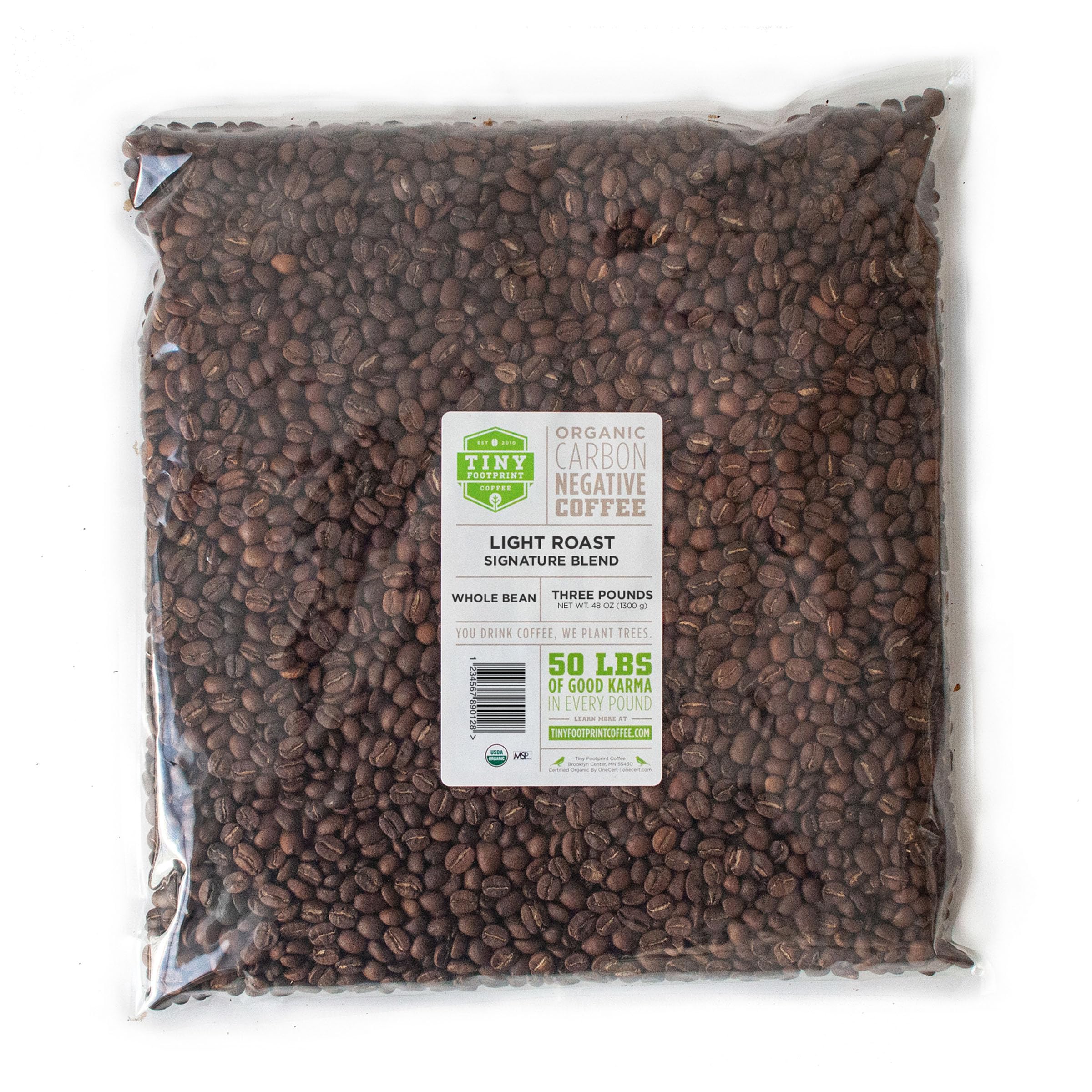 Tiny Footprint Coffee Signature Blend Light Roast beans ready for a bright, citrus-forward morning brew