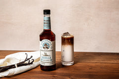 Close-up of Tippleman's bottle ready for barista pour in cafe