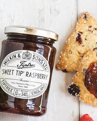 Tiptree Raspberry Preserve with visible seeds and glossy texture in a bowl
