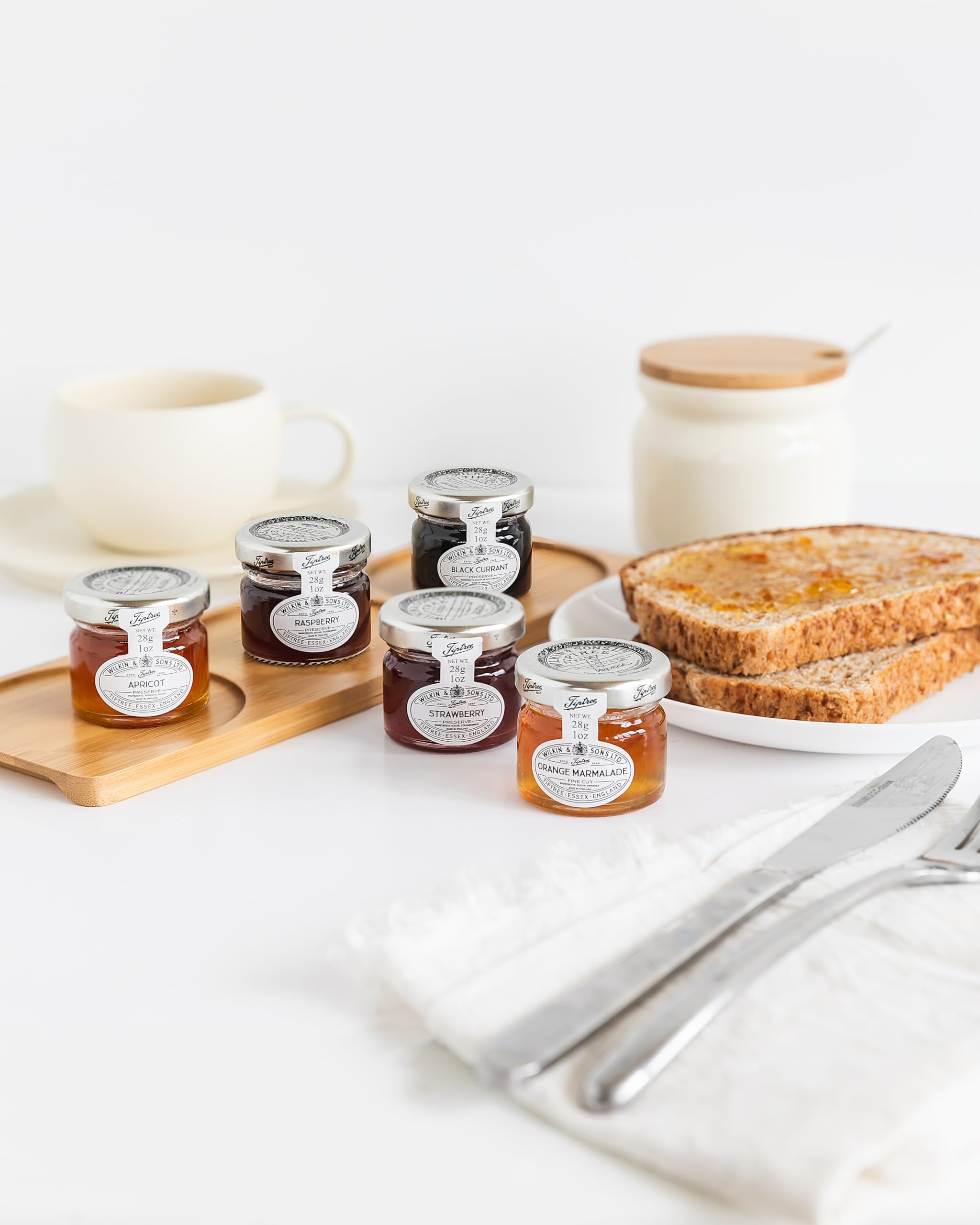 Tiptree Strawberry Preserve Minis case of 72 jars on shelf, ideal for gifting