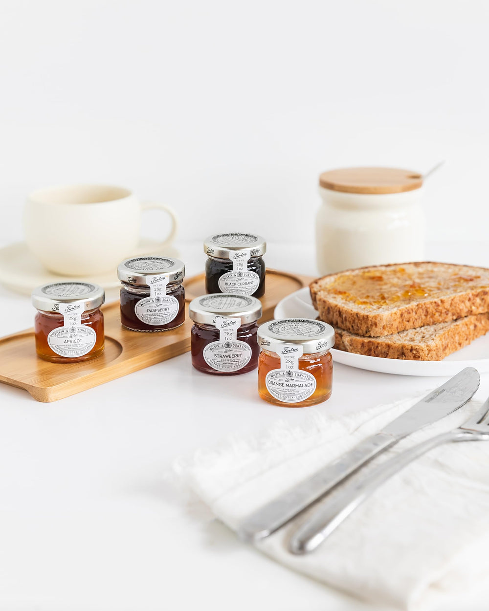 Tiptree Strawberry Preserve Minis case of 72 jars on shelf, ideal for gifting