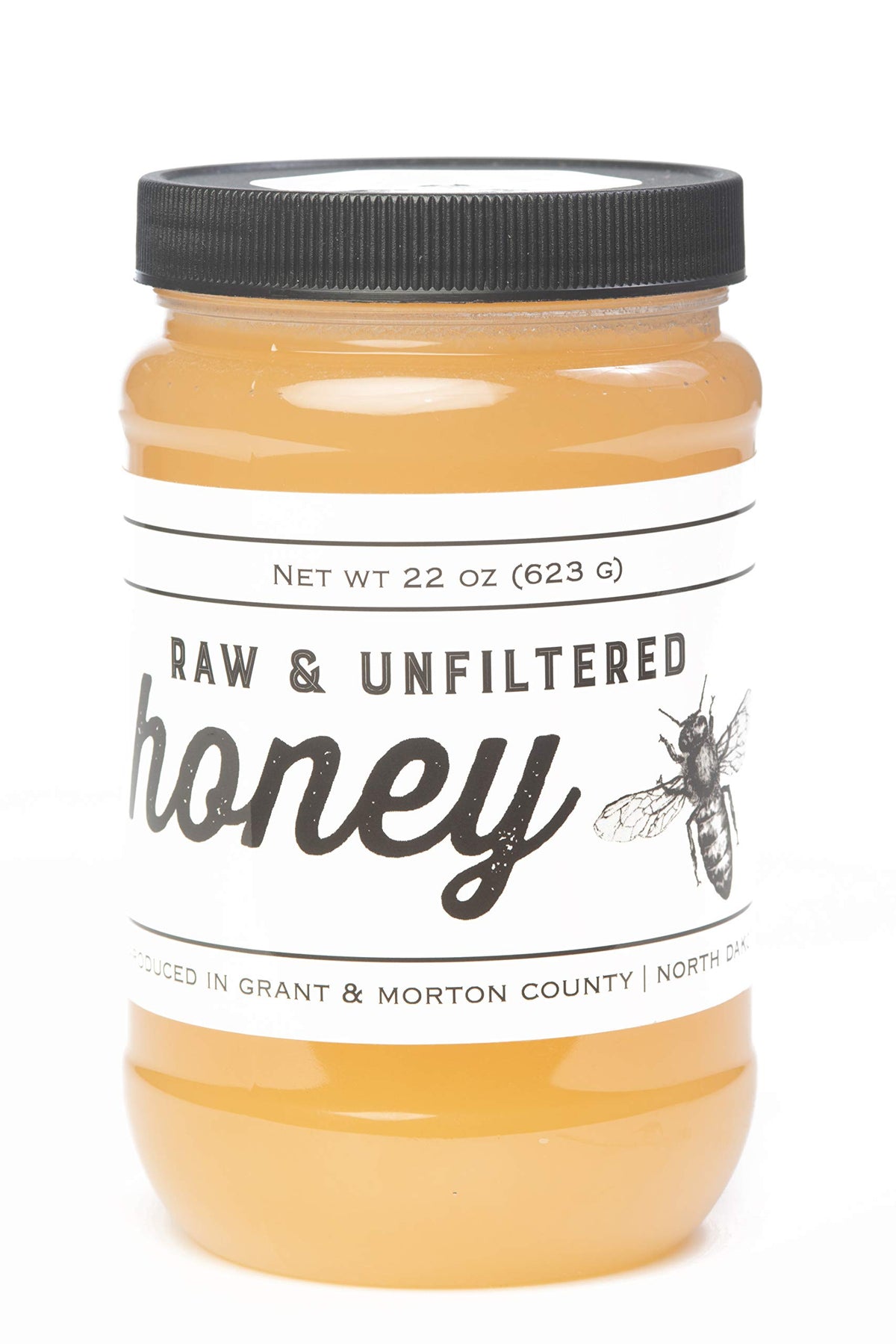 TJO Bees raw honey jar front view with rich amber color ideal for on-toast drizzle.