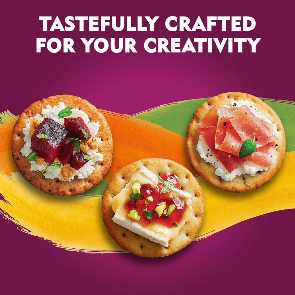 Toasteds crackers with hummus and dips on a serving platter.