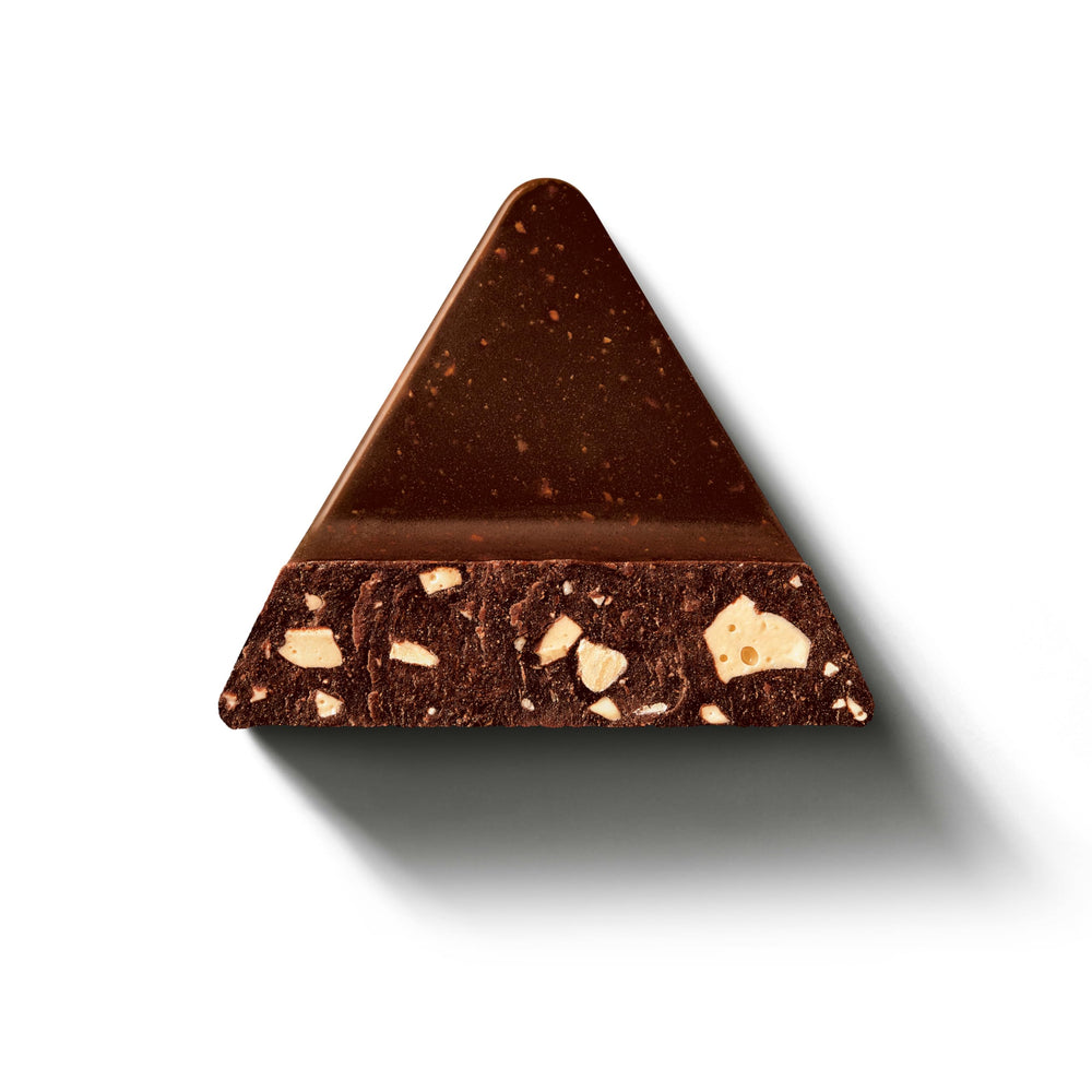 Honey and almond nougat pieces visible in Toblerone bar.