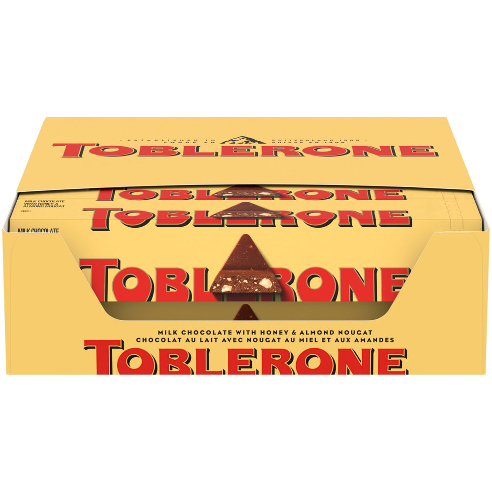Toblerone milk chocolate bars with honey and almond nougat in packaging ideal for gifting.