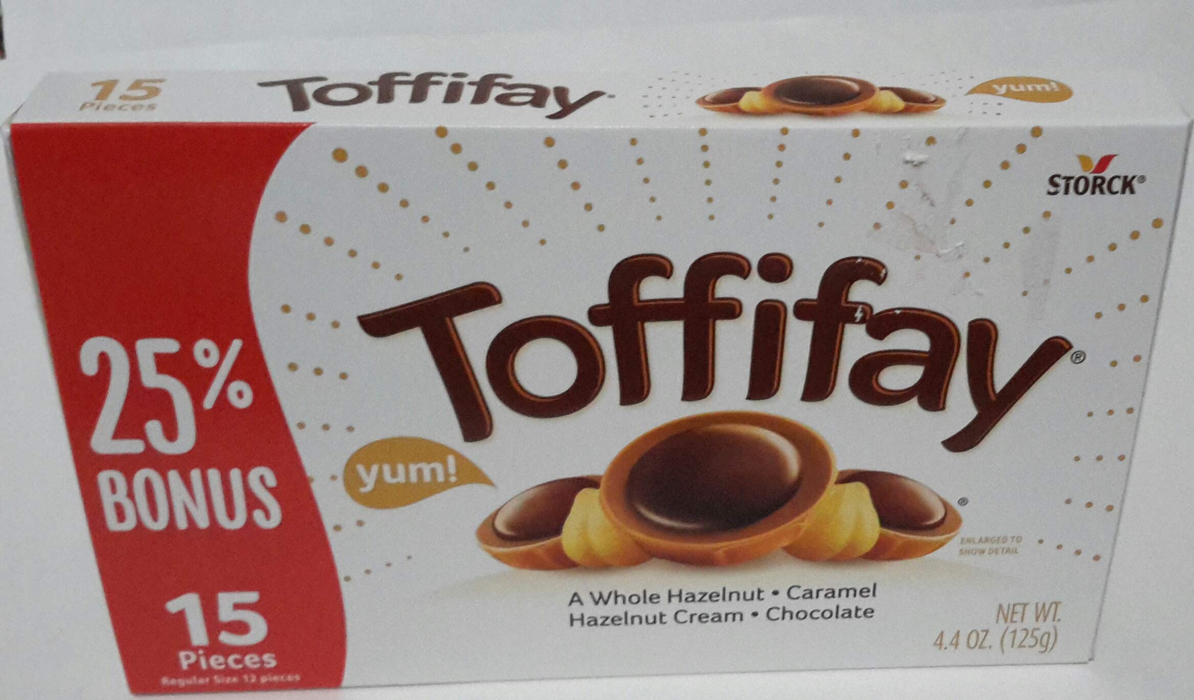 Toffifay whole hazelnut chocolate candy with a crisp shell and creamy center.