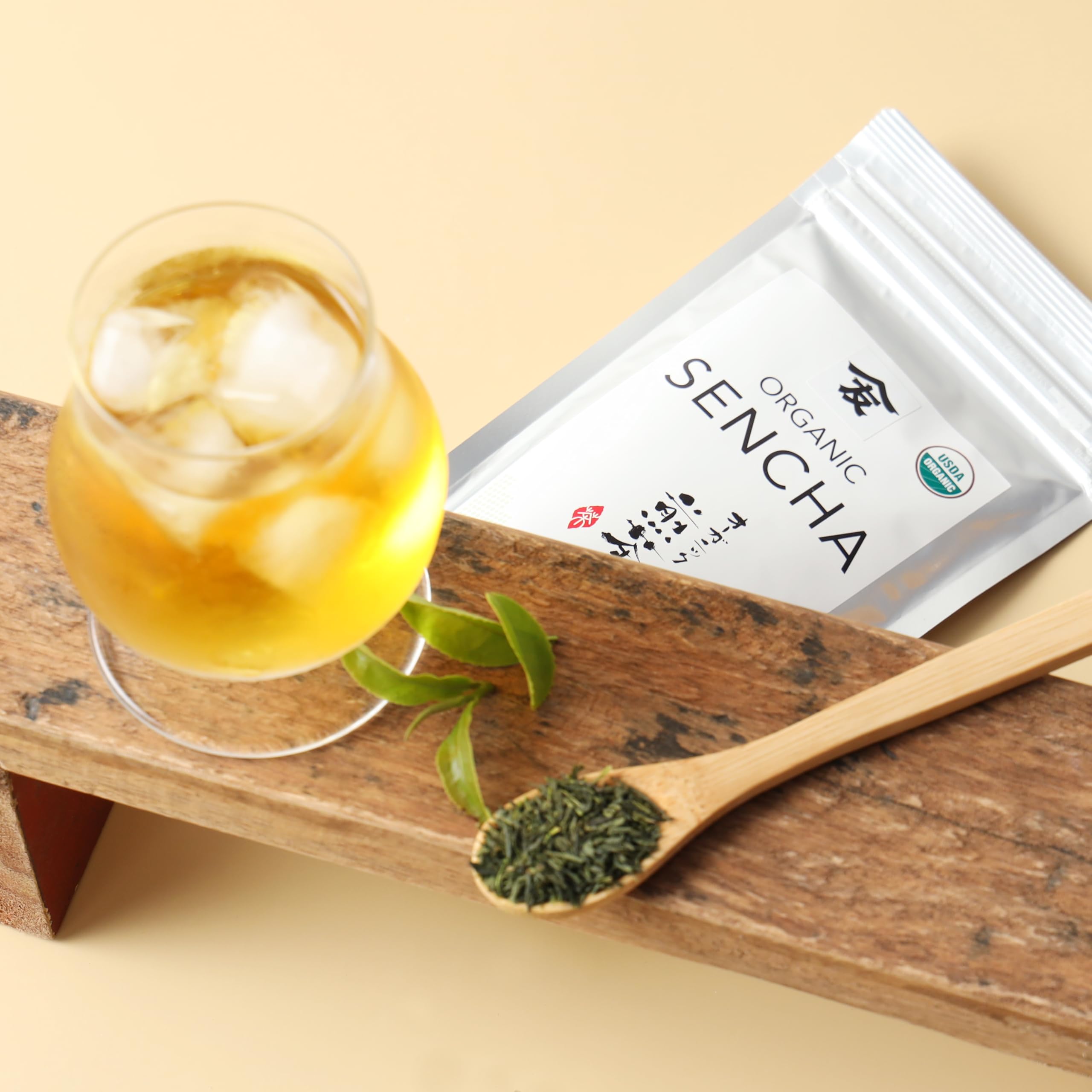 Sunlit TOMOSAN Sencha leaves signaling freshness.