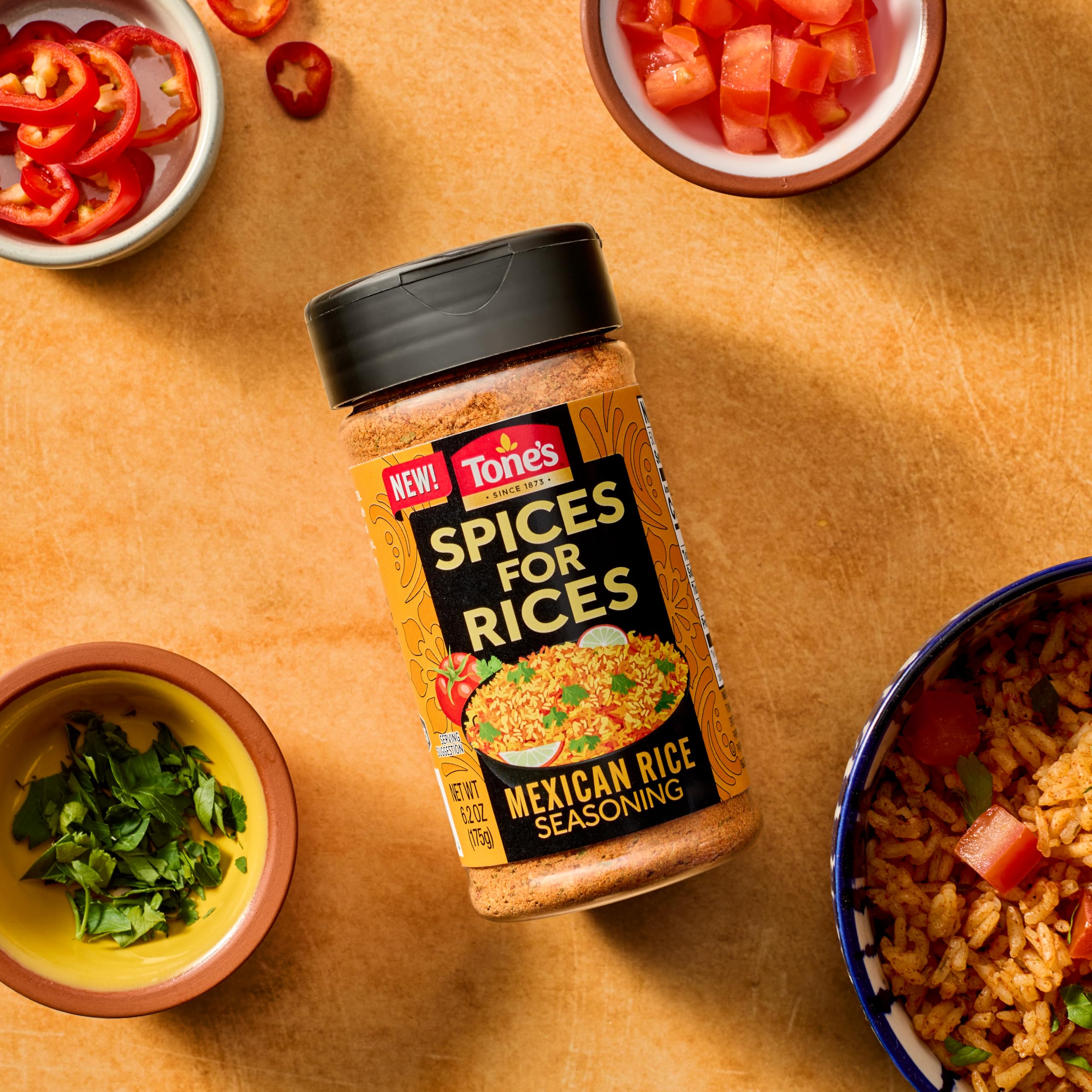 Tone's Spices for Rices measuring scoop demonstrates 1 Tbsp per 1/2 cup.