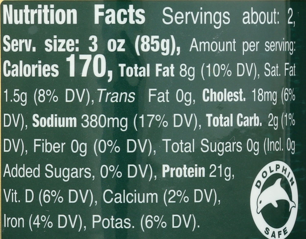 Tonnino tuna can close-up showcases oregano infusion in olive oil for rich flavor.