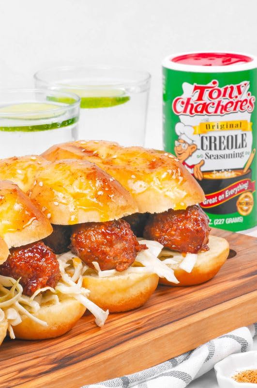 Tony Chachere's original seasoning canister sits in a busy kitchen, ready for versatile dishes.