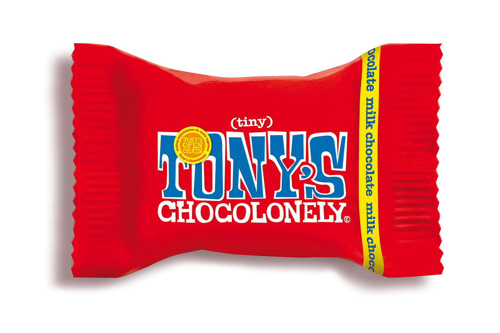 Tony's Chocolonely Tiny Tony's milk chocolate bites closeup – creamy texture and inviting aroma.