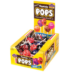 Tootsie Pops orange flavor close-up highlights a bright candy shell.