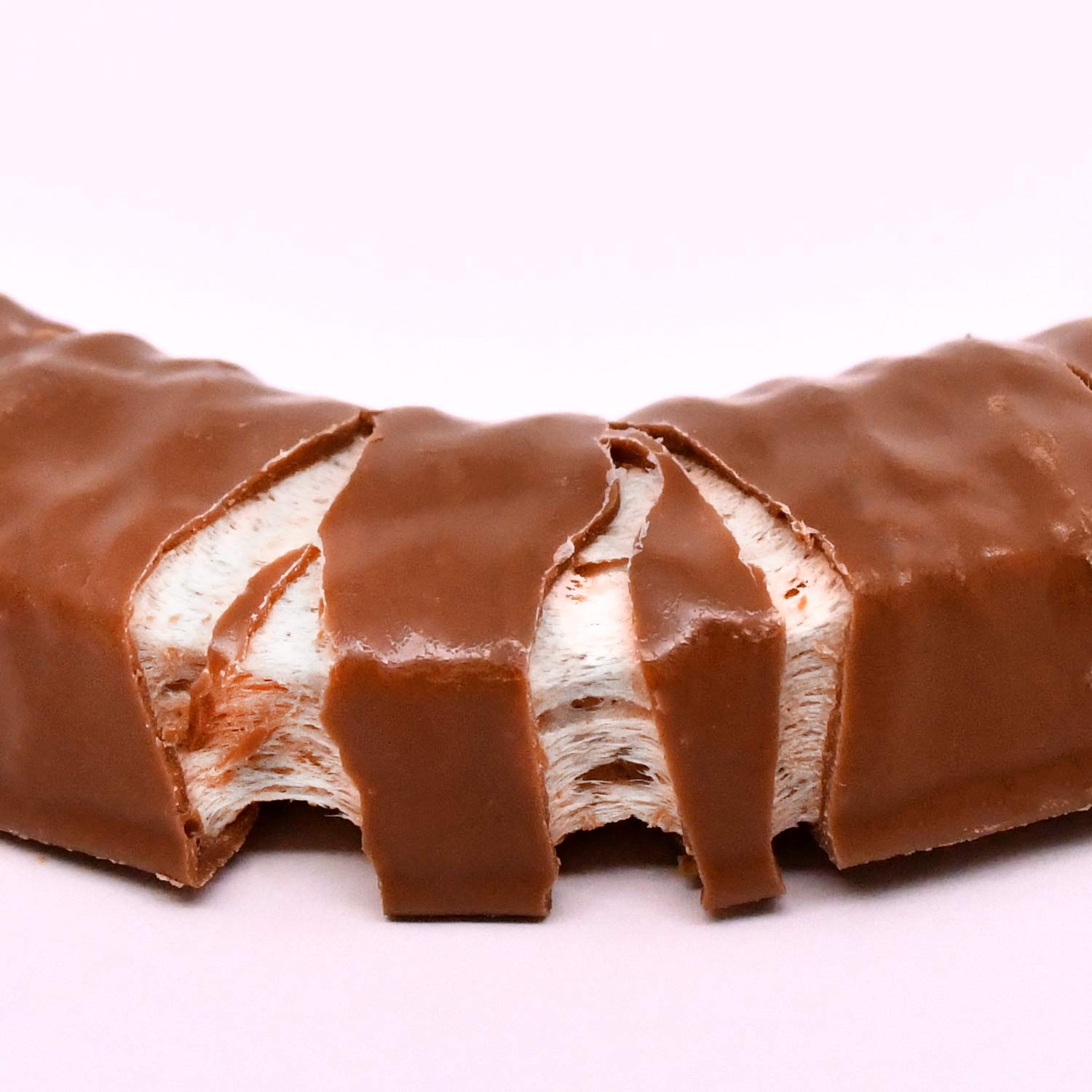 Tootsie Roll Charleston Chew vanilla bar coating detail highlights the smooth chocolate shell.