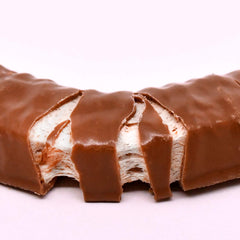Tootsie Roll Charleston Chew vanilla bar coating detail highlights the smooth chocolate shell.