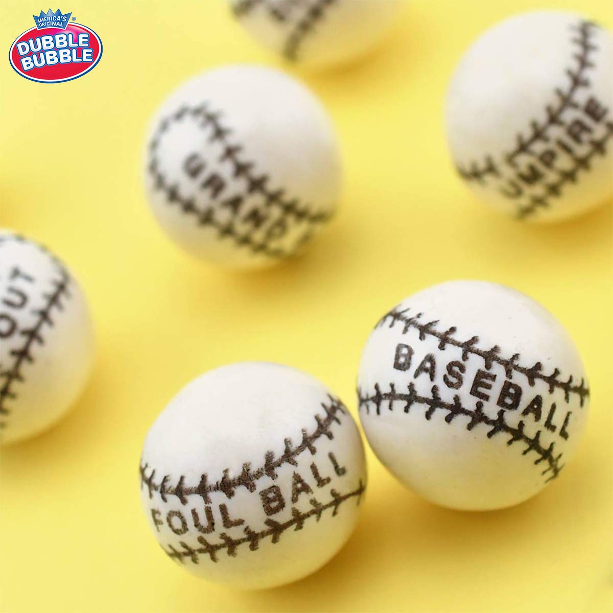 Tootsie Roll Dubble Bubble baseball gumballs close-up showing multicolor shells for celebrations.