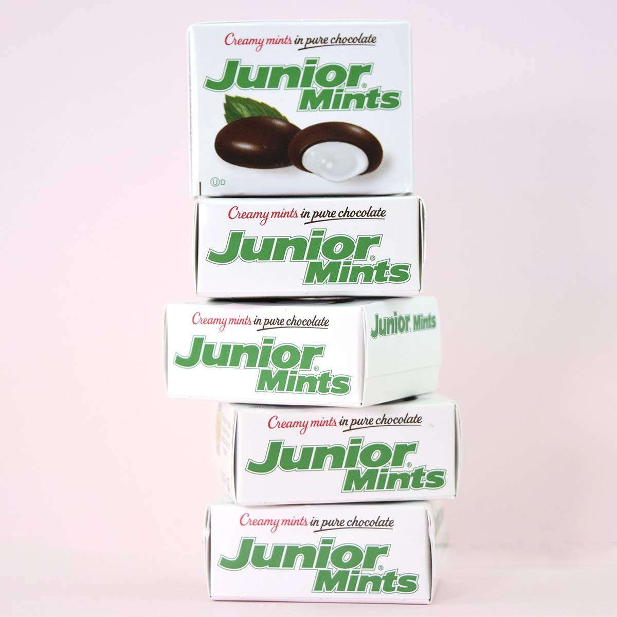 Chocolate-coated mint detail highlighting glossy coating and bite-size convenience.
